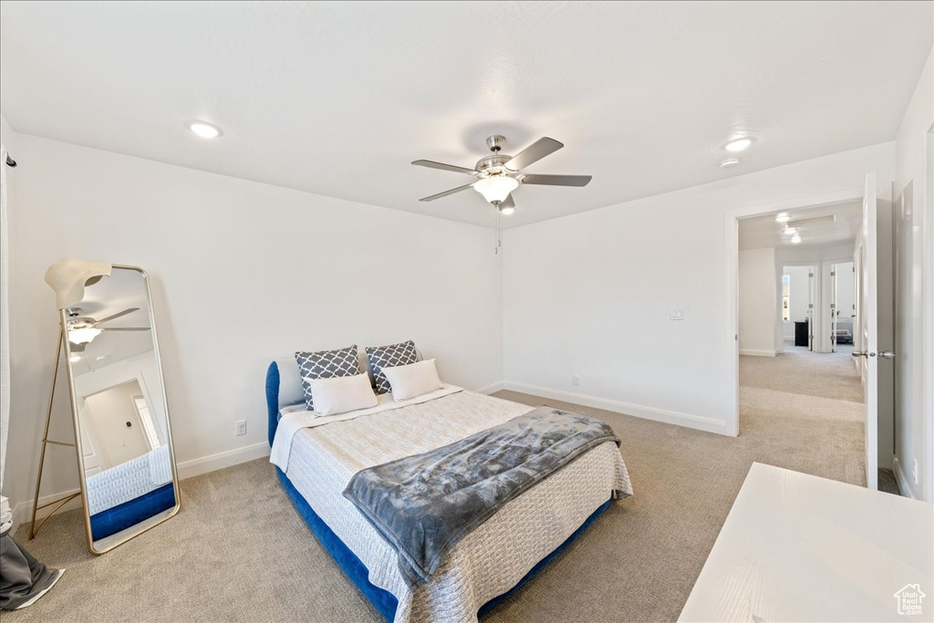 Bedroom featuring light carpet, ceiling fan, attic access, and recessed lighting