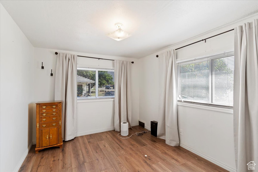 Unfurnished bedroom with light wood-style flooring