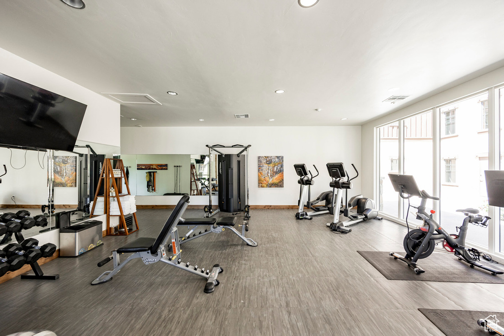 Exercise room with recessed lighting and wood finished floors