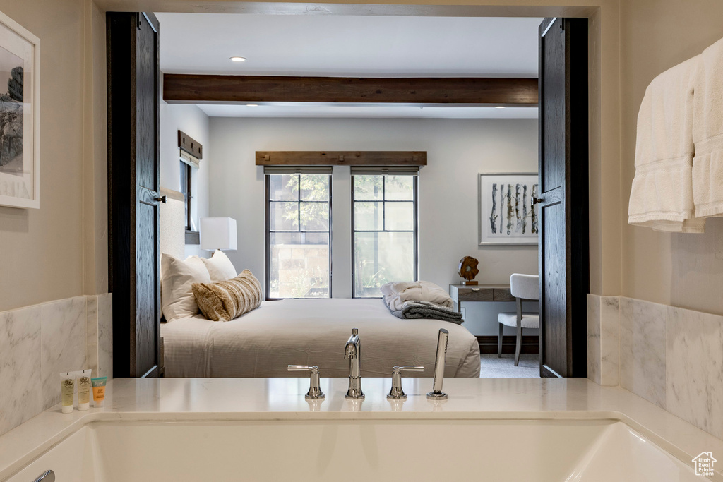 Bedroom with beamed ceiling