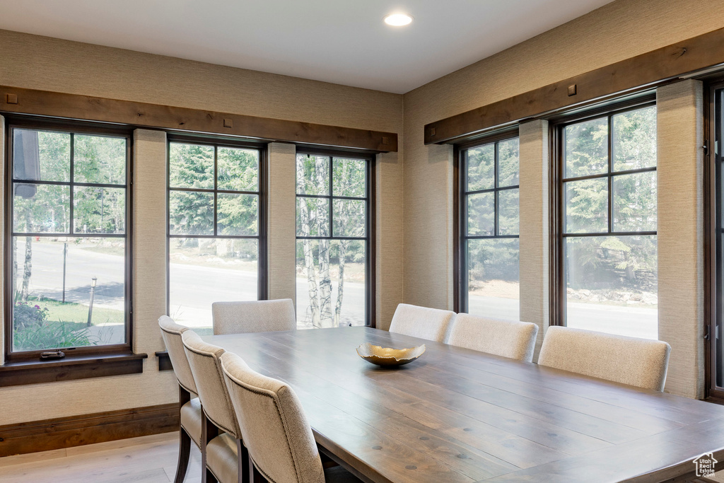 Dining room featuring wood finished floors and recessed lighting