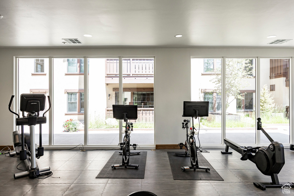 Workout area with recessed lighting and baseboards