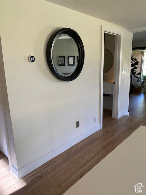Detailed view of wood finished floors and baseboards
