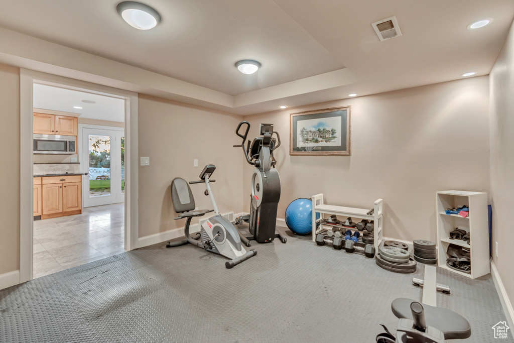 Exercise area featuring baseboards and recessed lighting