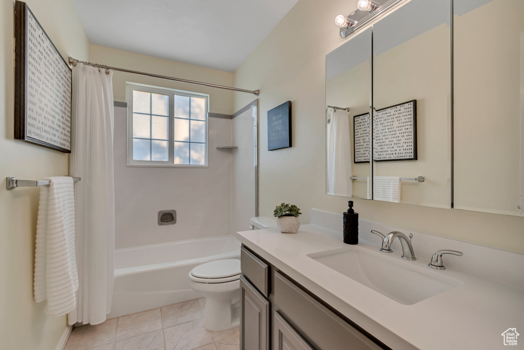 Full bath with vanity and shower / bathtub combination with curtain