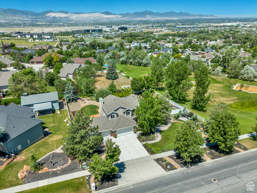 Aerial view of property\'s location with a mountainous background and nearby suburban area