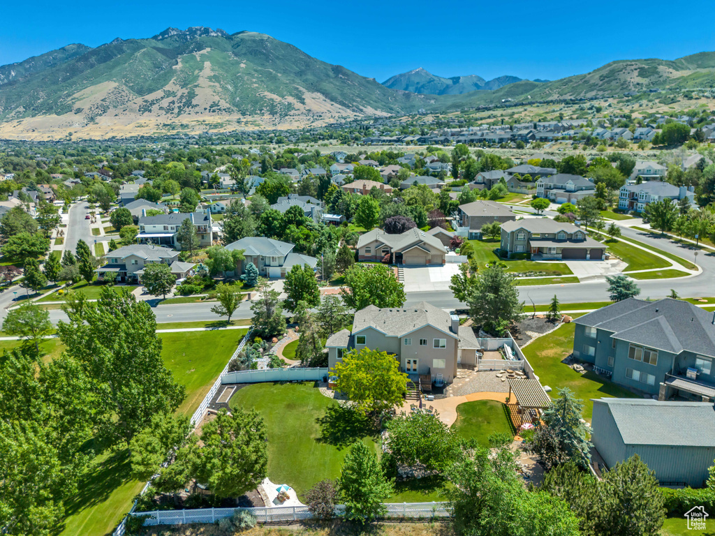 Aerial perspective of suburban area with a mountain backdrop