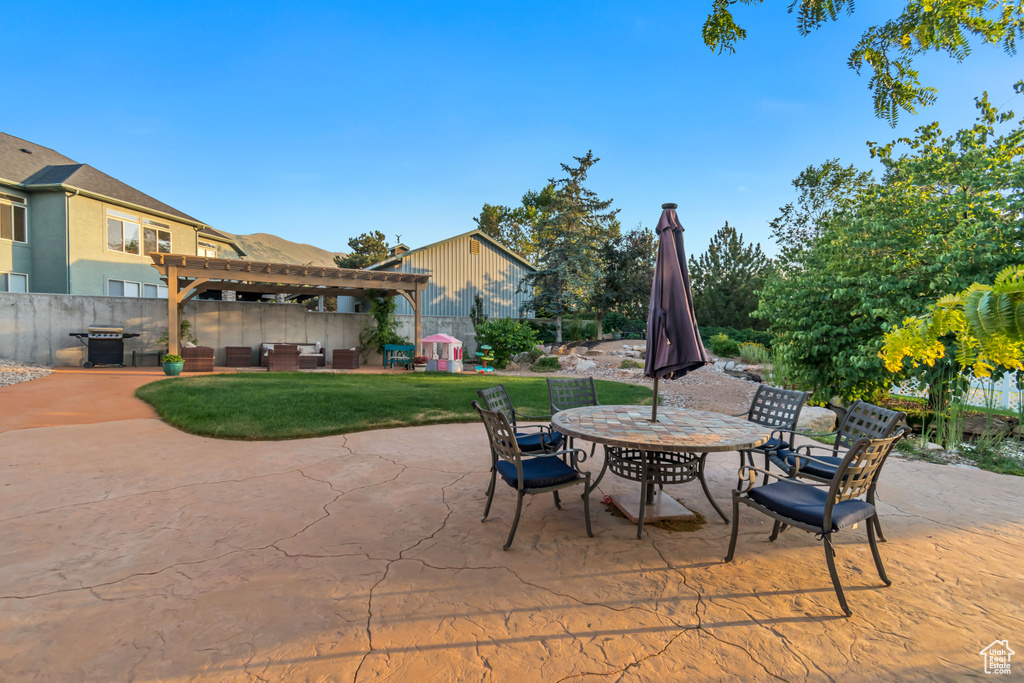 View of patio / terrace featuring outdoor dining space, a pergola, and outdoor lounge area
