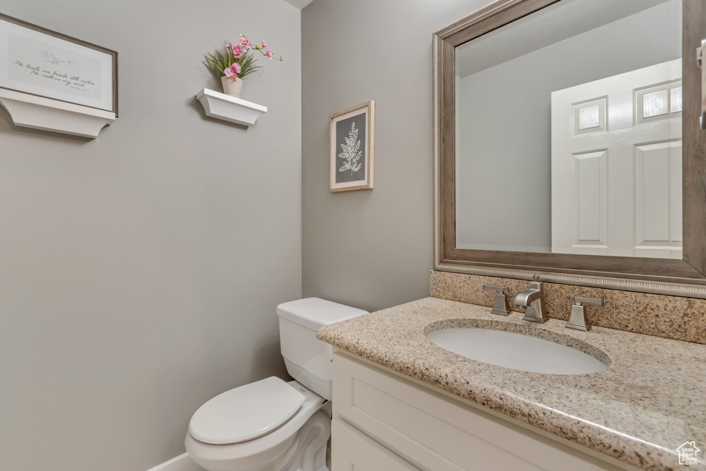 Bathroom featuring toilet and vanity
