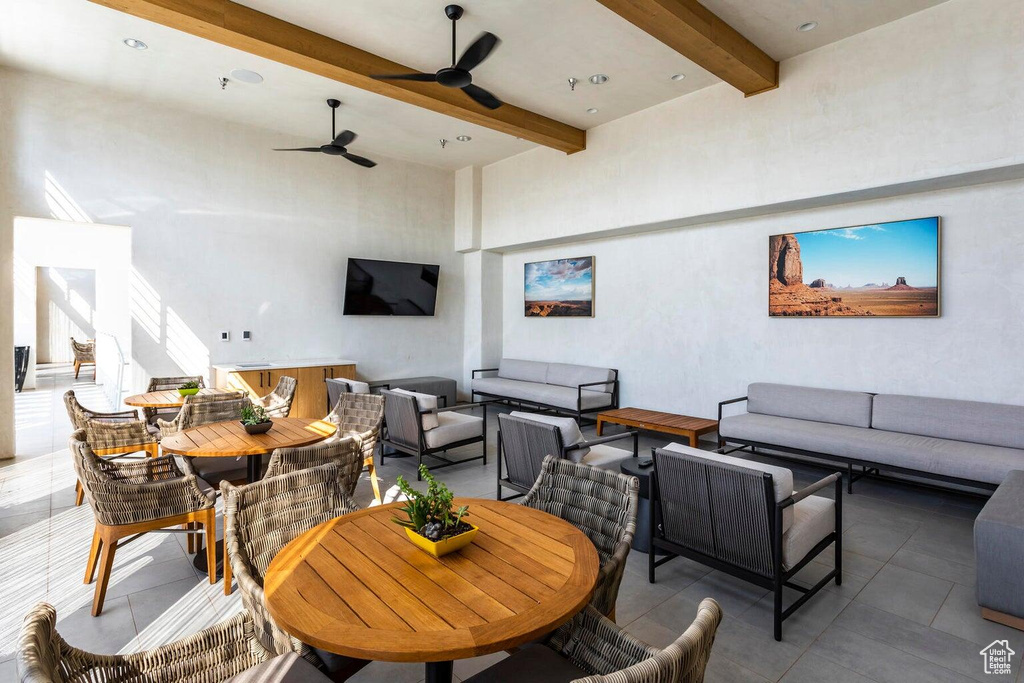 View of patio with an outdoor living space, outdoor dining area, and ceiling fan