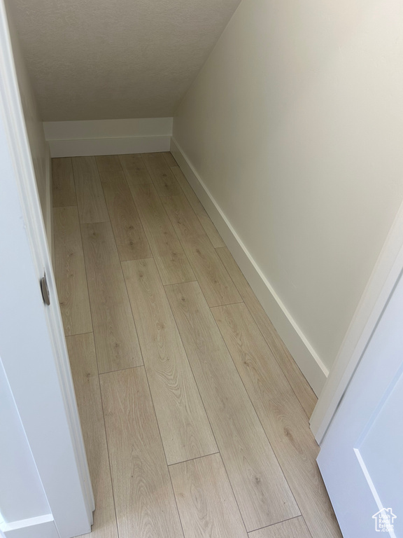 Detailed view of wood finished floors and baseboards