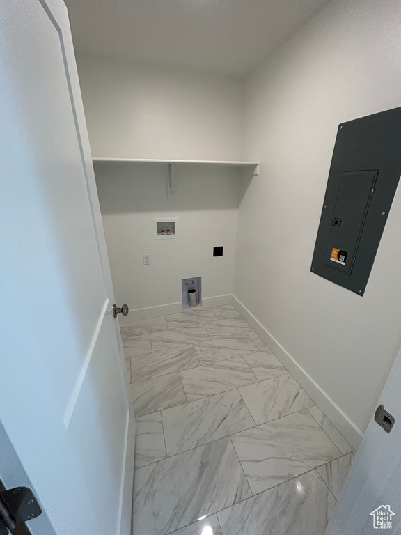 Laundry room with electric panel, light marble finish flooring, and hookup for a washing machine