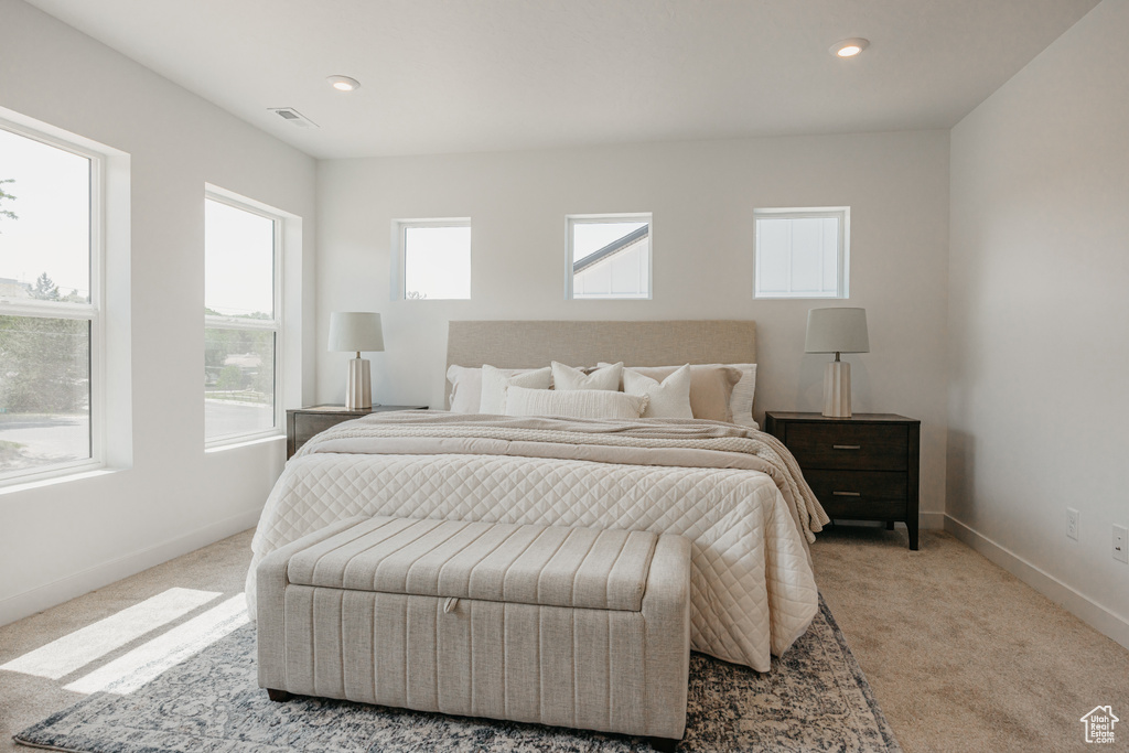 Carpeted bedroom featuring baseboards and recessed lighting