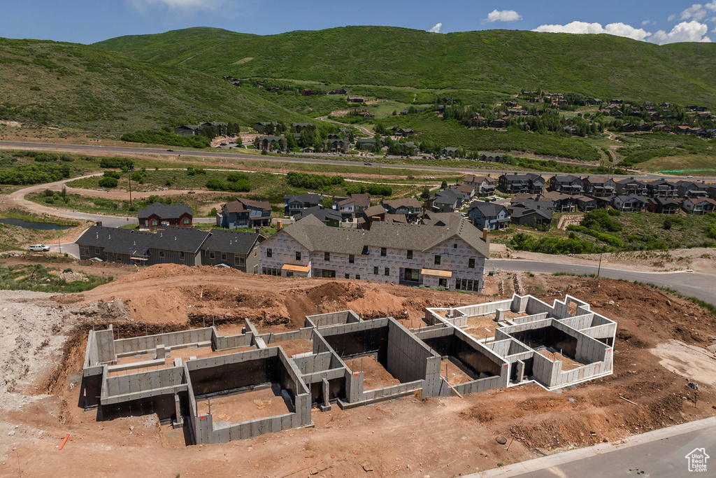 Aerial perspective of suburban area featuring mountains and property parcel outlined