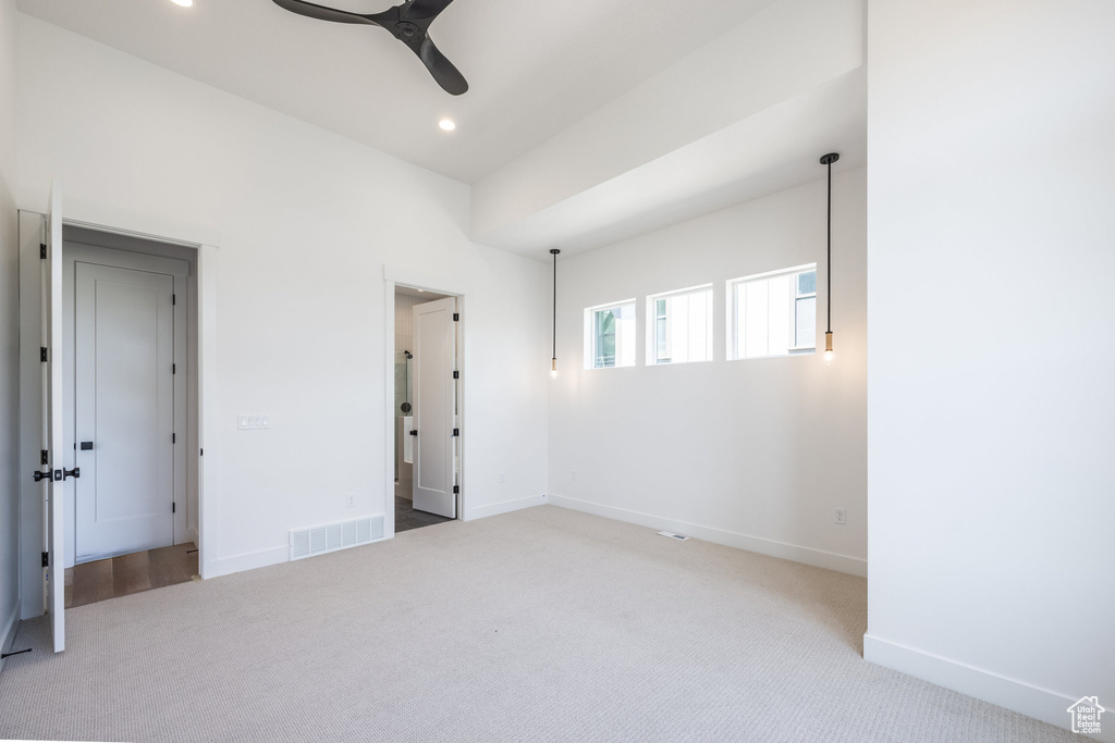 Unfurnished room featuring ceiling fan, carpet flooring, and recessed lighting