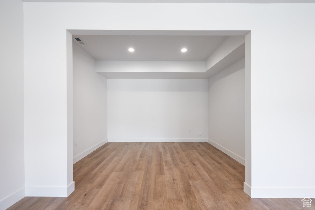 Unfurnished room with light wood-type flooring and recessed lighting