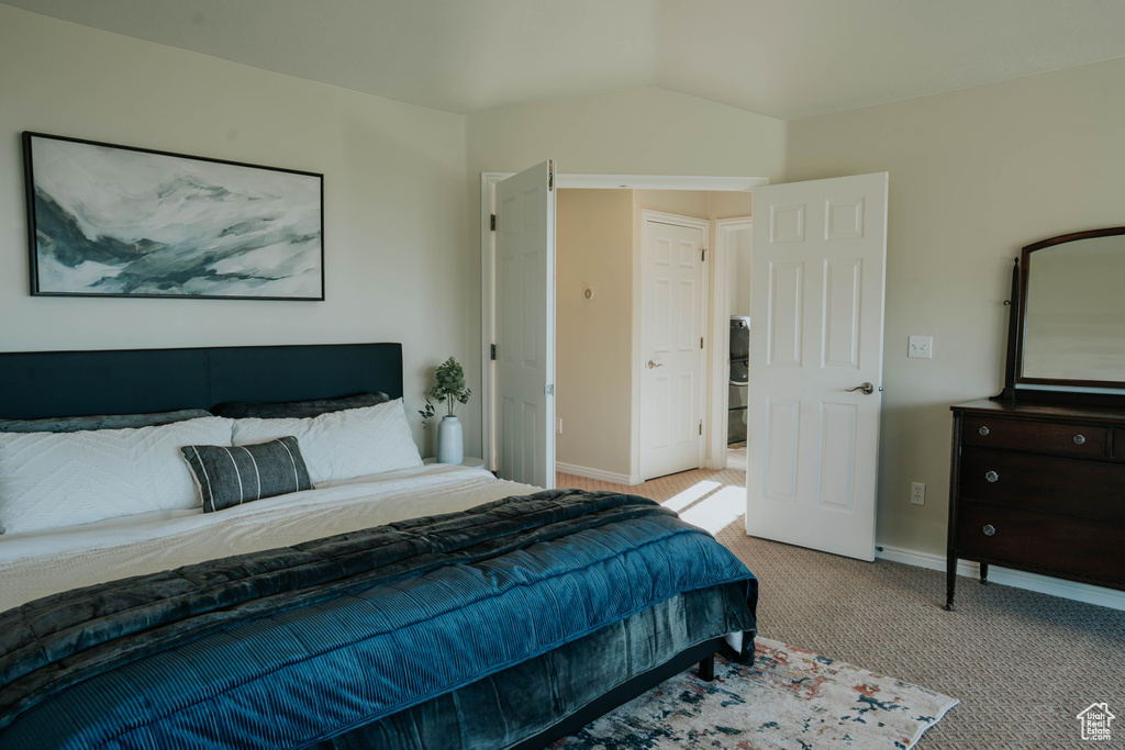 Carpeted bedroom featuring baseboards