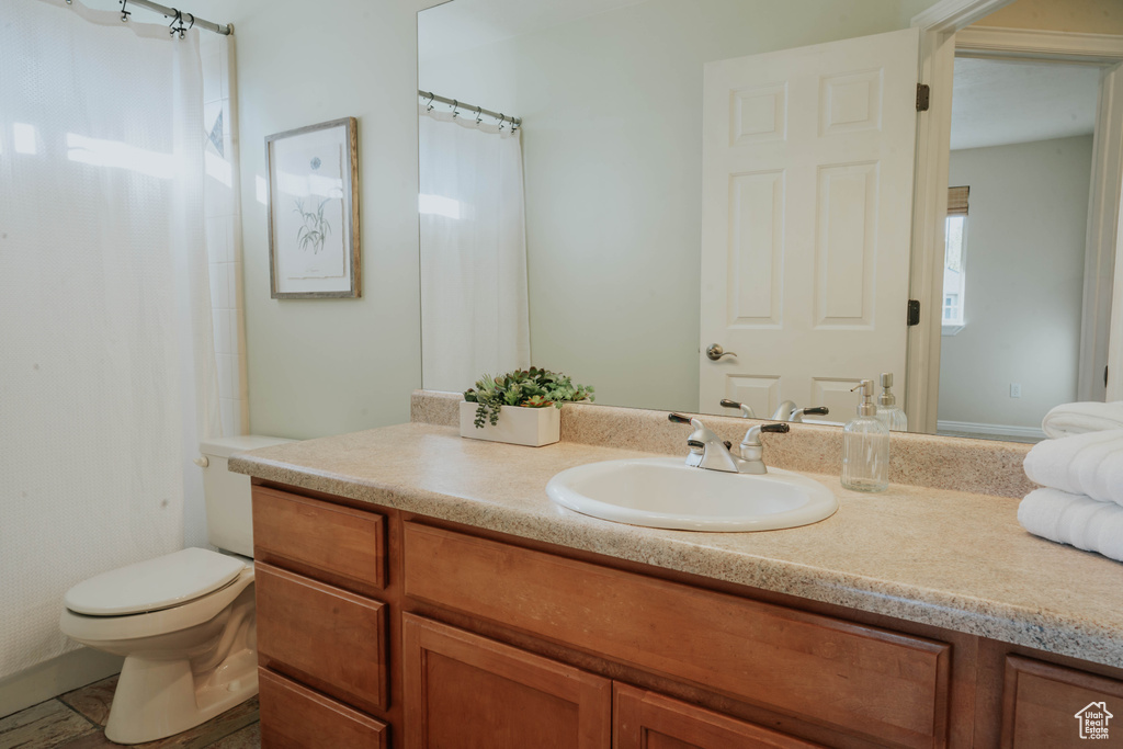 Bathroom featuring vanity and a shower with curtain