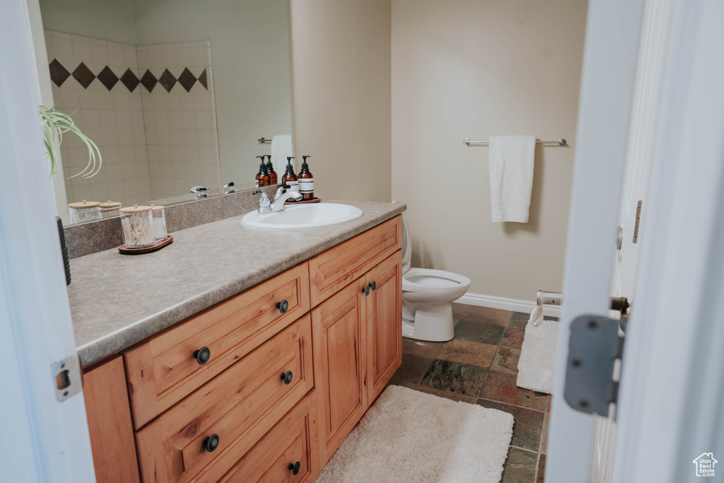 Bathroom featuring vanity and stone tile flooring
