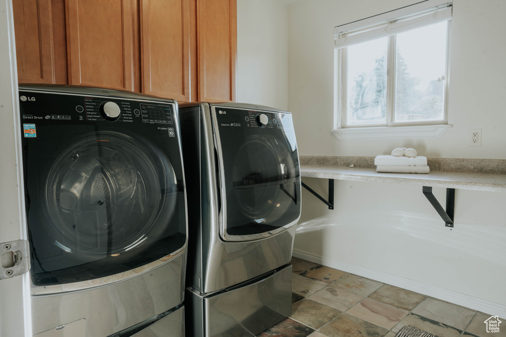 Washroom with separate washer and dryer and cabinet space