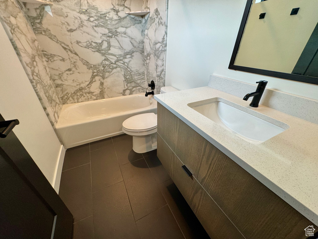 Full bath with vanity, bathing tub / shower combination, and tile patterned floors