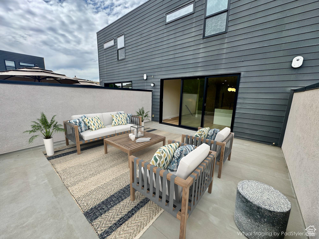 View of patio featuring an outdoor hangout area