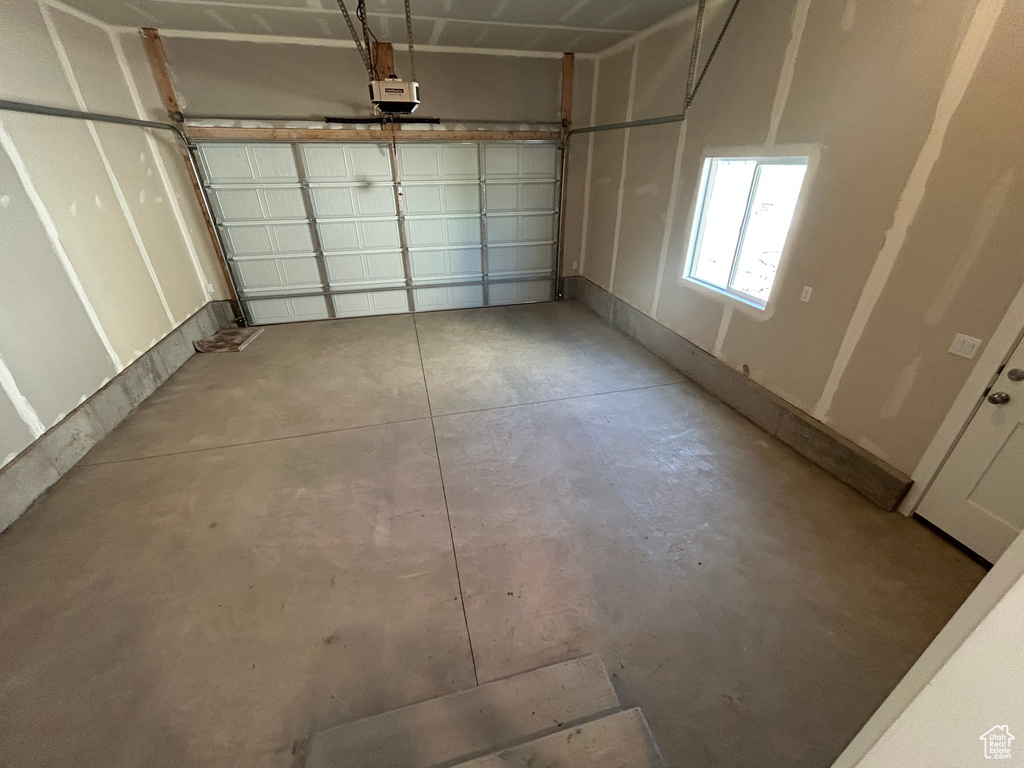 Garage featuring a garage door opener