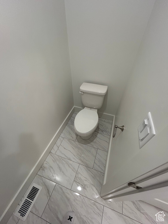 Bathroom with marble finish flooring and baseboards