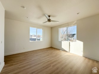 Spare room with ceiling fan and wood finished floors