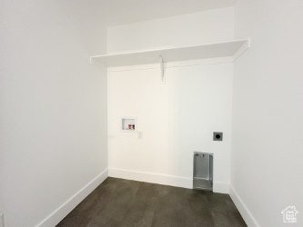 Washroom with hookup for a washing machine and hookup for an electric dryer