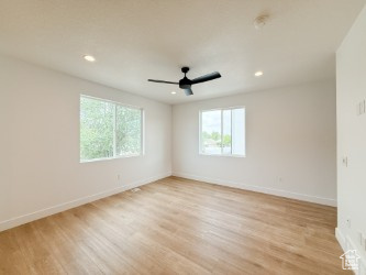 Spare room featuring light wood-style flooring, recessed lighting, and ceiling fan