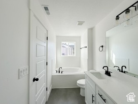 Full bathroom featuring a bath and vanity
