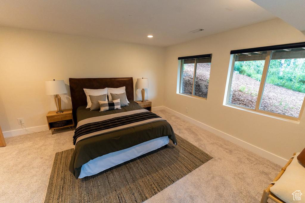 Bedroom with carpet floors and recessed lighting