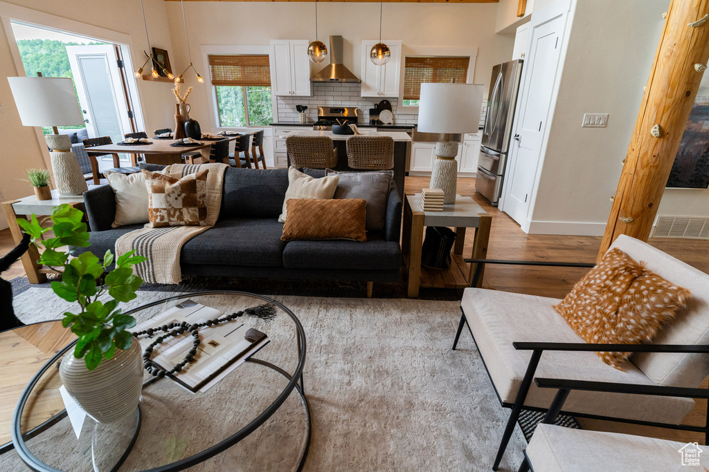 Living area with light wood-style floors and baseboards