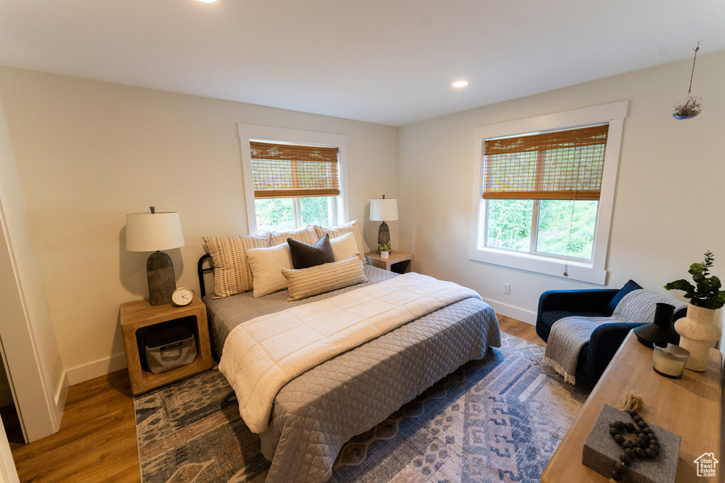 Bedroom featuring wood finished floors and recessed lighting