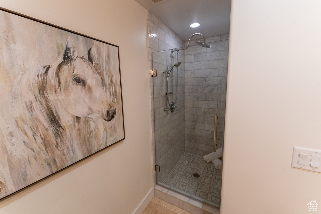 Full bathroom featuring a stall shower and recessed lighting