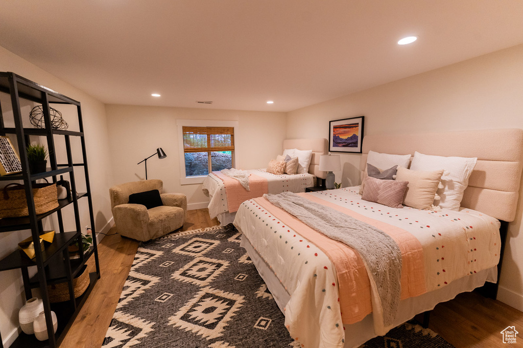 Bedroom featuring wood finished floors and recessed lighting