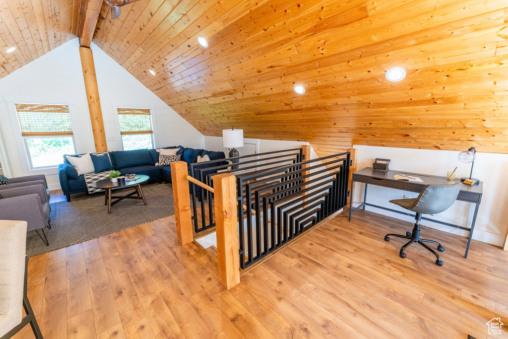 Office area featuring vaulted ceiling, wood-type flooring, and wood ceiling