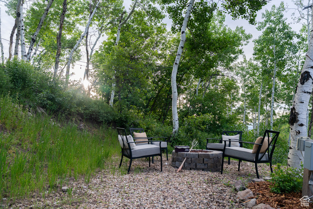 View of yard with an outdoor fire pit