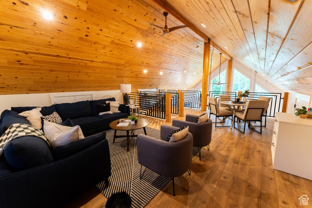 Living area with wood ceiling, lofted ceiling, and hardwood / wood-style flooring