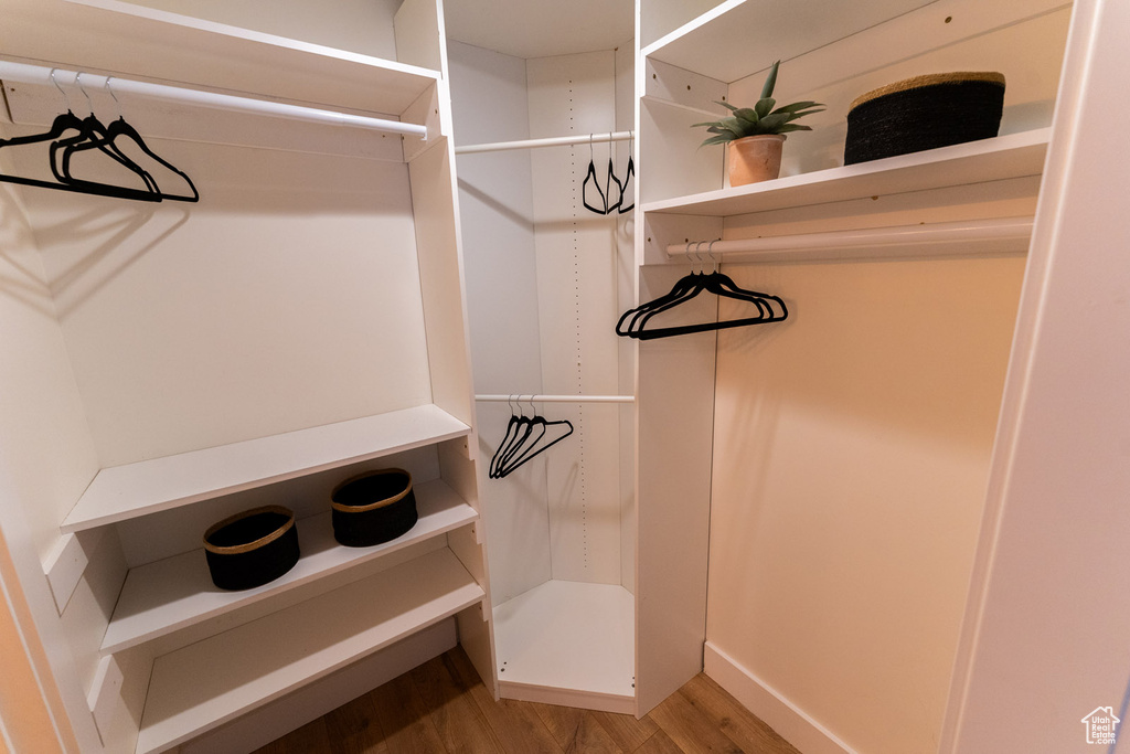 Walk in closet featuring light wood-type flooring