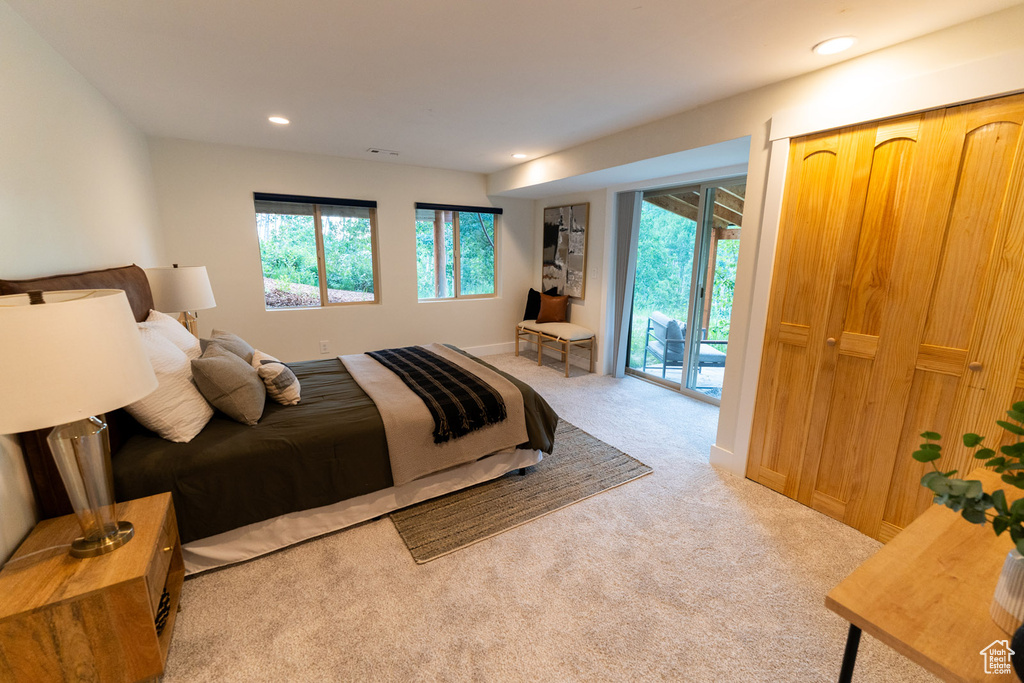 Bedroom featuring access to outside, carpet flooring, and recessed lighting