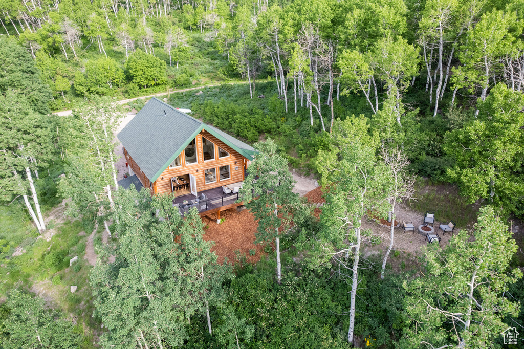 View of subject property with a forest