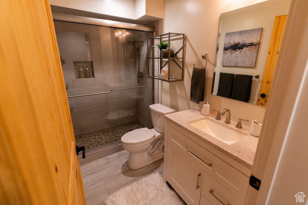 Bathroom featuring a stall shower and vanity