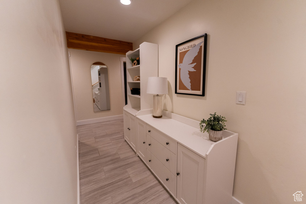 Hall with recessed lighting and beam ceiling