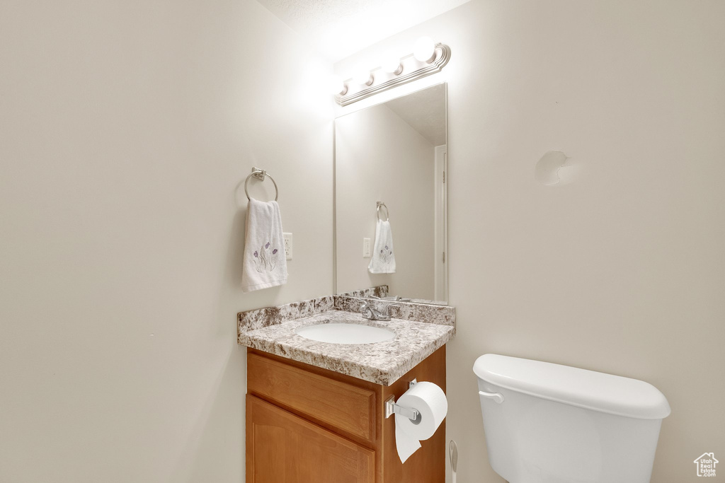 Bathroom with vanity and toilet
