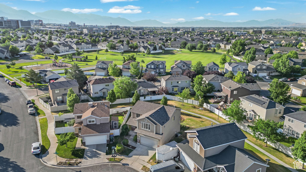 Aerial perspective of suburban area with a mountainous background