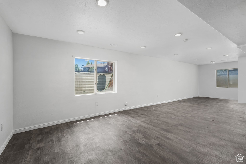 Empty room featuring wood finished floors, recessed lighting, and a smoke detector