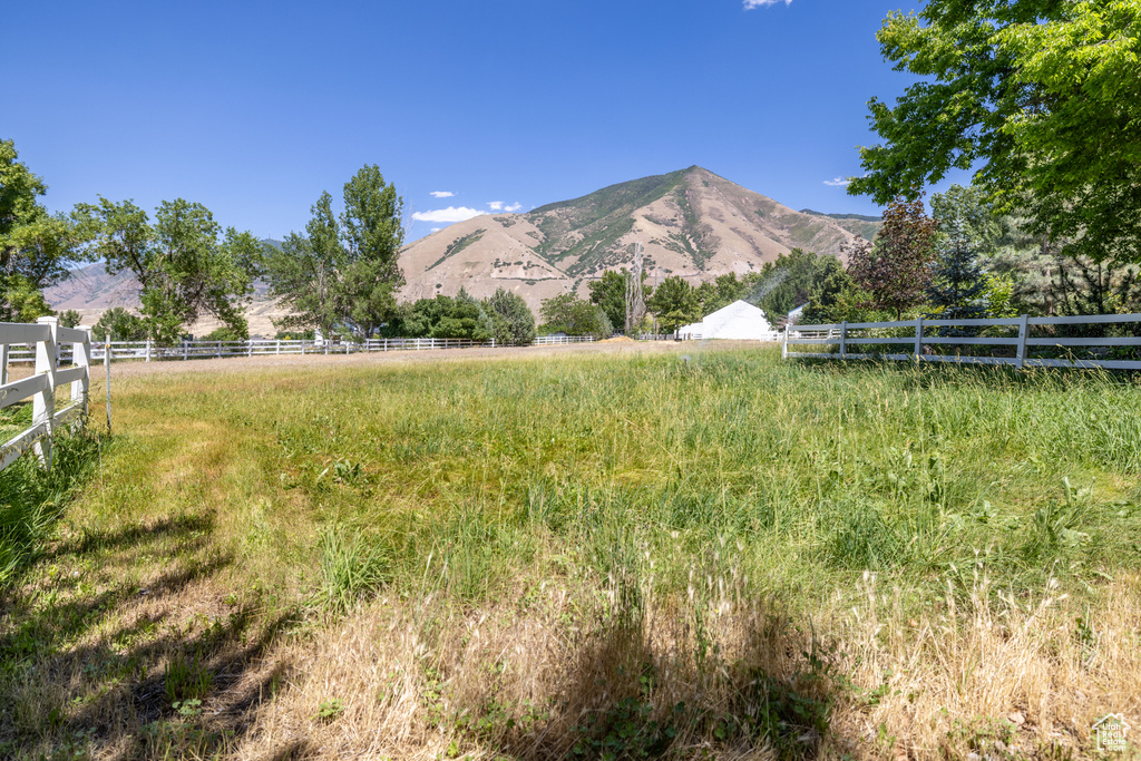 View of mountain backdrop with rural landscape
