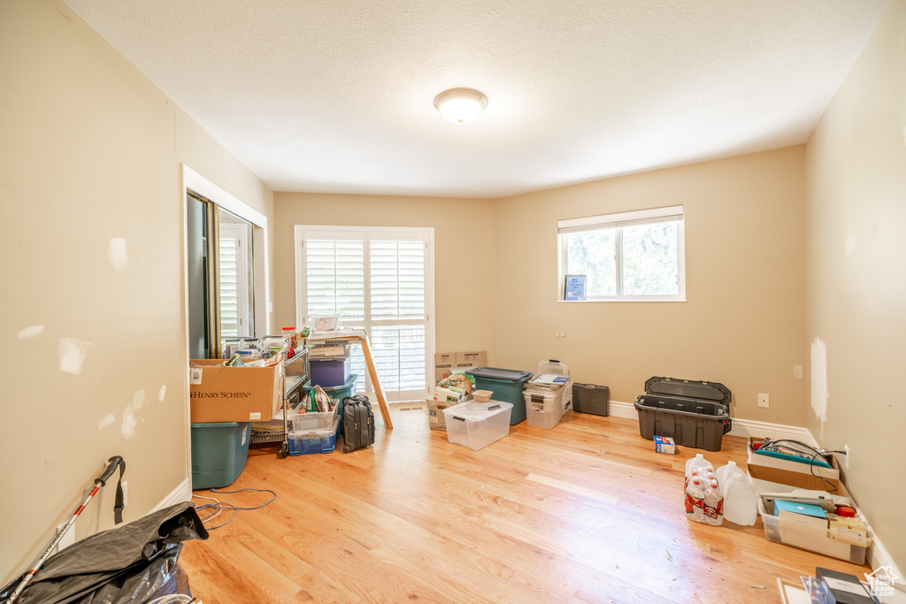 Miscellaneous room featuring wood finished floors and baseboards